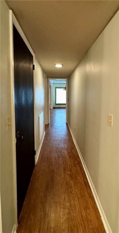 hall featuring dark wood-type flooring