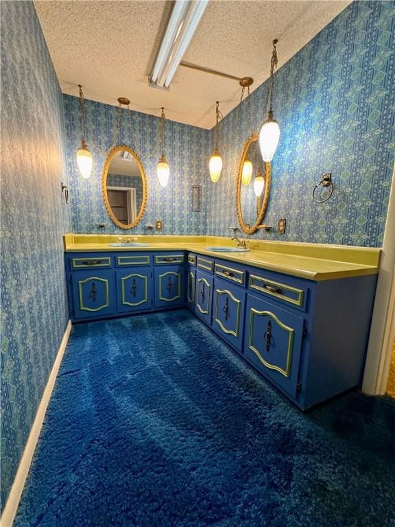 bathroom featuring vanity and a textured ceiling