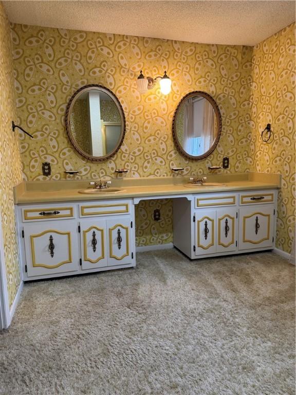 bathroom featuring vanity and a textured ceiling