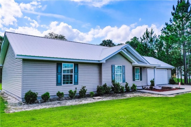 4718 Otter Creek Cir, Blackshear, GA 31516 - ranch-style house with an attached garage, a front lawn, and a metal roof