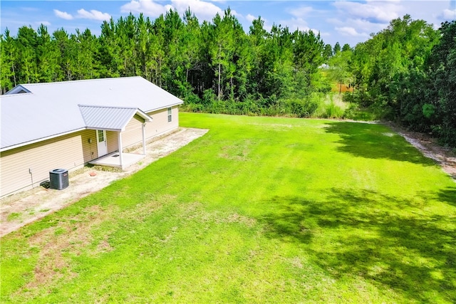 4718 Otter Creek Cir, Blackshear, GA 31516 - view of green lawn featuring a patio area and a wooded view