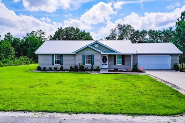 4718 Otter Creek Cir, Blackshear, GA 31516 - ranch-style house with a garage, concrete driveway, a front yard, and a metal roof
