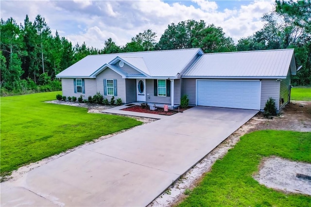 4718 Otter Creek Cir, Blackshear, GA 31516 - ranch-style house featuring an attached garage, concrete driveway, a front yard, and a metal roof