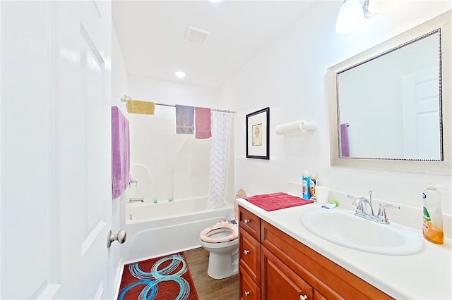 4718 Otter Creek Cir, Blackshear, GA 31516 - bathroom featuring vanity, shower / bath combo with shower curtain, and wood finished floors