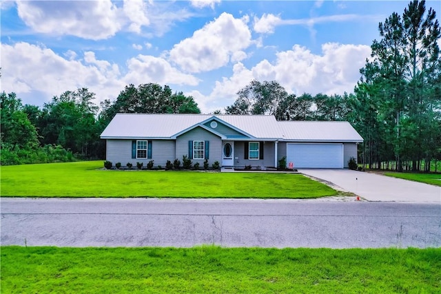 4718 Otter Creek Cir, Blackshear, GA 31516 - ranch-style house featuring an attached garage, a front lawn, driveway, and a metal roof