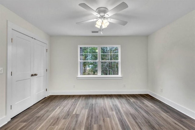 unfurnished bedroom with wood-type flooring and ceiling fan