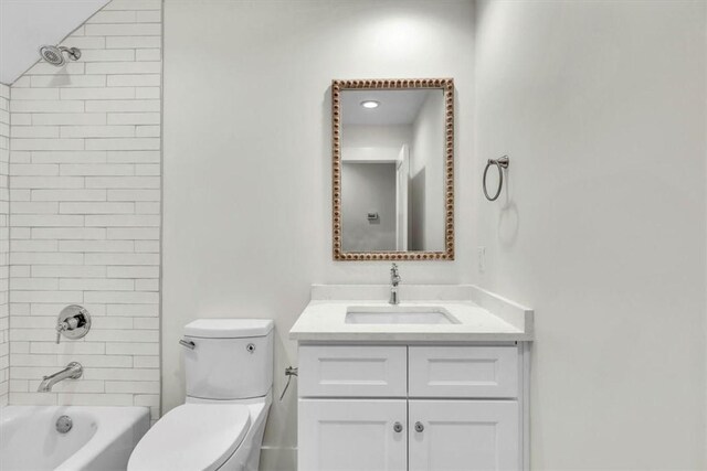 full bathroom featuring vanity, toilet, and tiled shower / bath combo