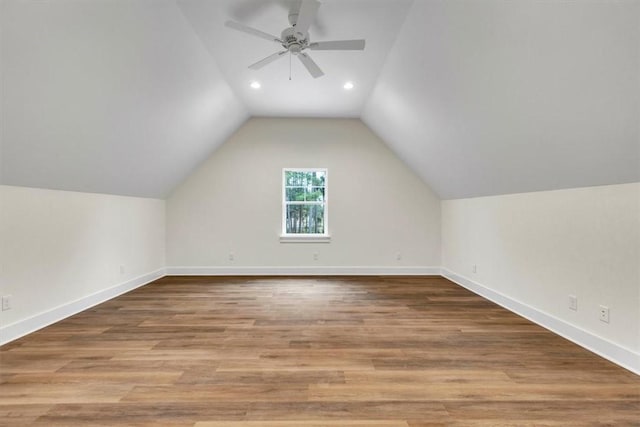 bonus room with lofted ceiling, hardwood / wood-style floors, and ceiling fan