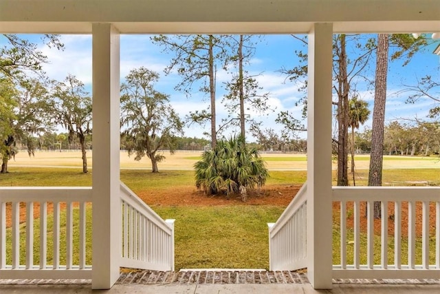 view of yard with covered porch