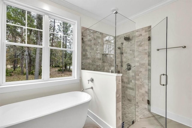 bathroom featuring crown molding and independent shower and bath