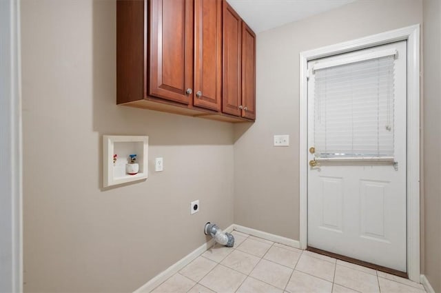 washroom featuring cabinets, washer hookup, electric dryer hookup, and light tile patterned flooring