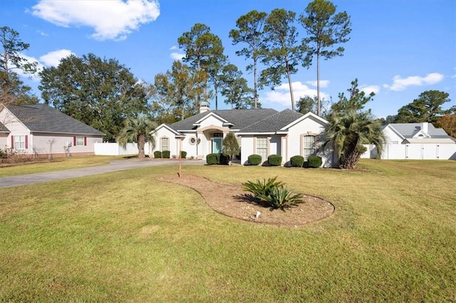 single story home featuring a front yard