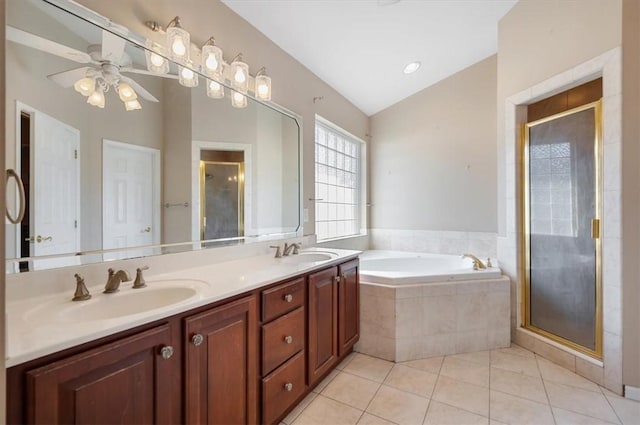 bathroom featuring vaulted ceiling, independent shower and bath, tile patterned flooring, and vanity