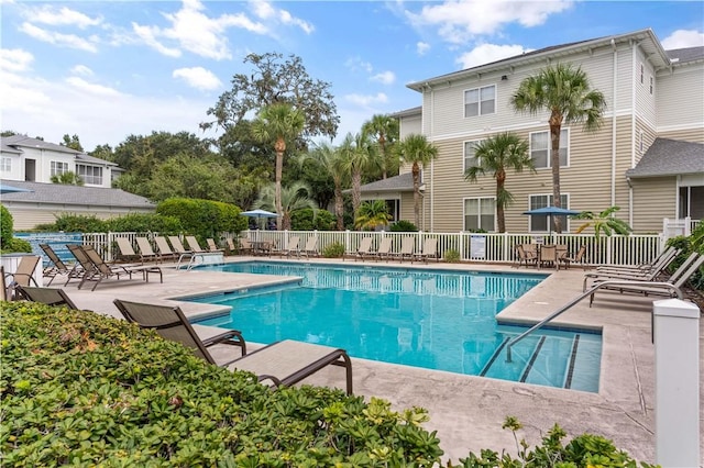 view of swimming pool with a patio area