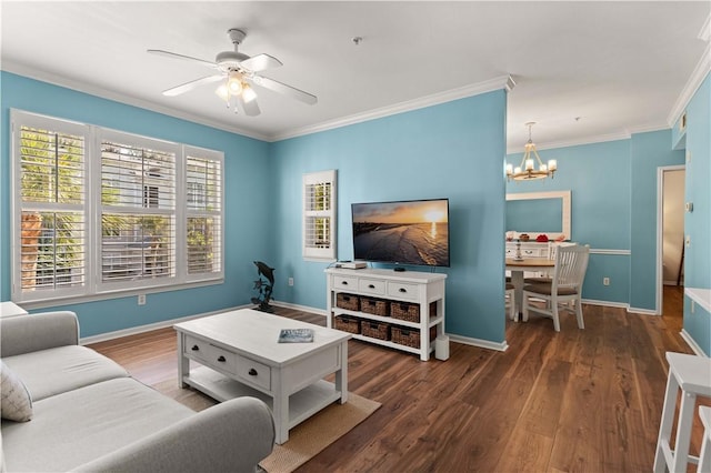 living room with ceiling fan with notable chandelier, crown molding, and dark wood-type flooring