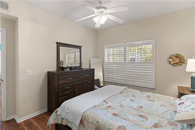 bedroom with ceiling fan and dark wood-type flooring