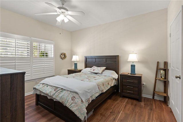 bedroom with ceiling fan and dark hardwood / wood-style floors