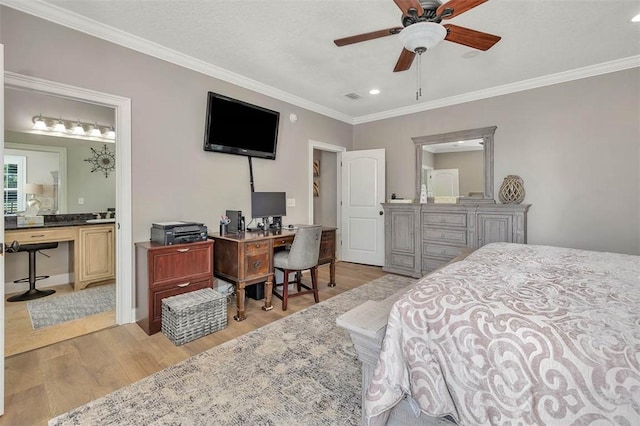 bedroom featuring ceiling fan, light hardwood / wood-style floors, crown molding, and ensuite bathroom