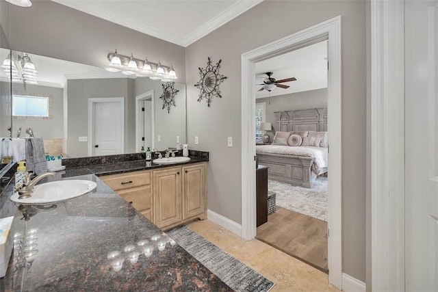 bathroom with tile patterned floors, ceiling fan, ornamental molding, and vanity