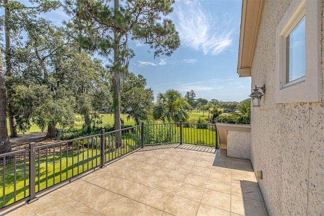 view of patio featuring a balcony