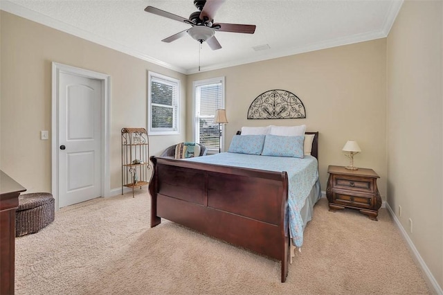 bedroom featuring ceiling fan, light colored carpet, a textured ceiling, and ornamental molding