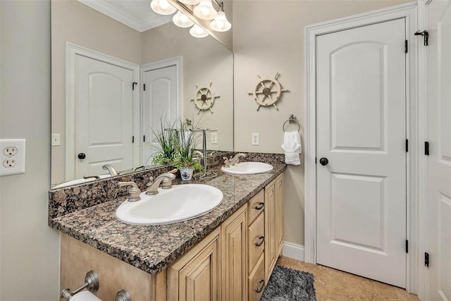 bathroom with tile patterned flooring, vanity, and ornamental molding