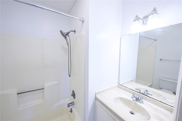 full bathroom with vanity,  shower combination, and toilet