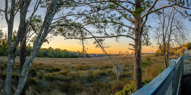 nature at dusk featuring a rural view