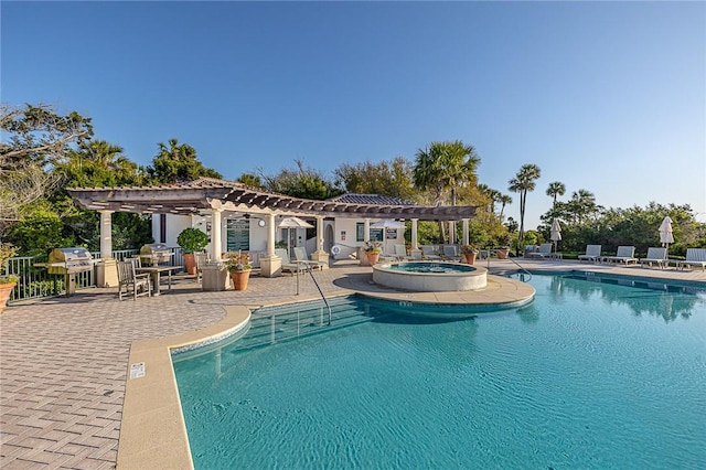 view of pool with a pergola, a patio, and a hot tub