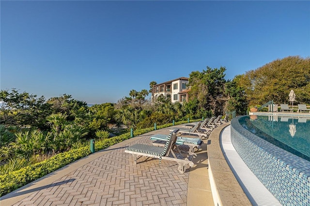 view of swimming pool with a patio area