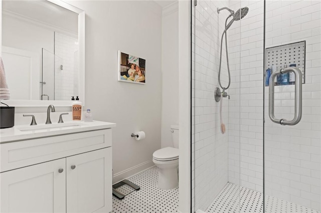 bathroom with a stall shower, baseboards, toilet, tile patterned floors, and vanity