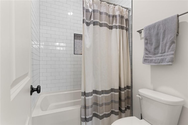 bathroom with toilet and shower / bath combo with shower curtain