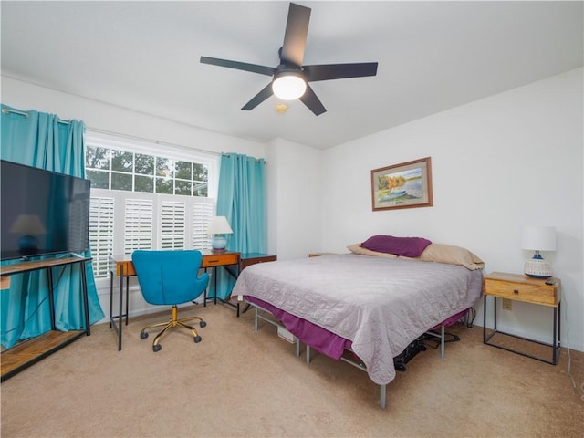 bedroom featuring ceiling fan and carpet floors