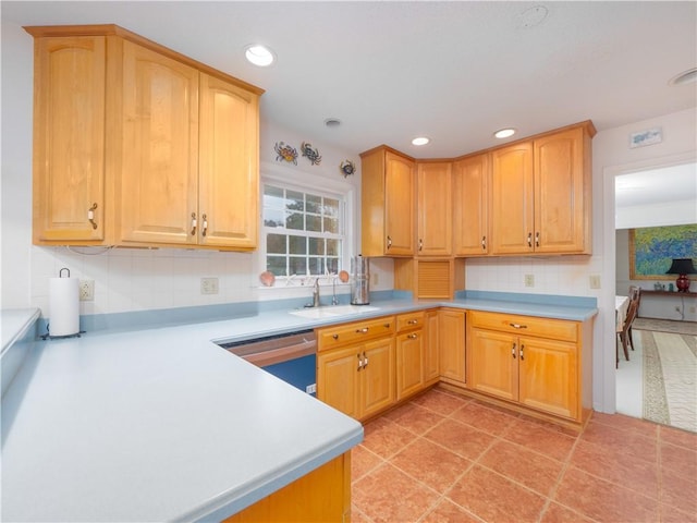 kitchen with tasteful backsplash, sink, light tile patterned flooring, and stainless steel dishwasher