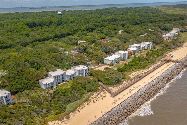 aerial view with a water view and a wooded view