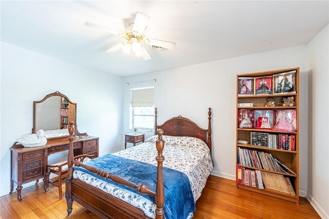 177 Pinewood St, Folkston, GA 31537 - bedroom with light wood-style flooring and a ceiling fan