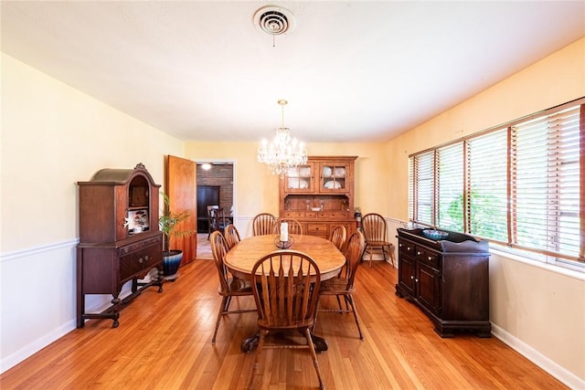 177 Pinewood St, Folkston, GA 31537 - dining area featuring a chandelier and light wood-style flooring
