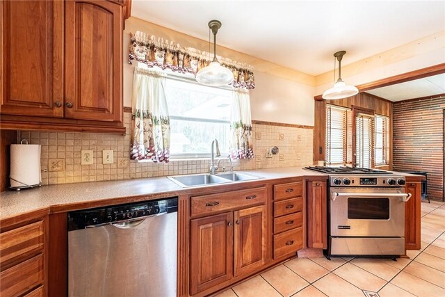 177 Pinewood St, Folkston, GA 31537 - kitchen with appliances with stainless steel finishes, brown cabinets, light tile patterned floors, and light countertops