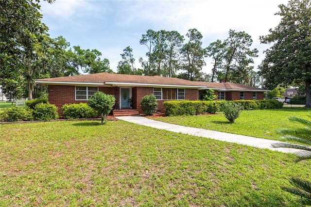 177 Pinewood St, Folkston, GA 31537 - ranch-style house featuring a front yard and brick siding
