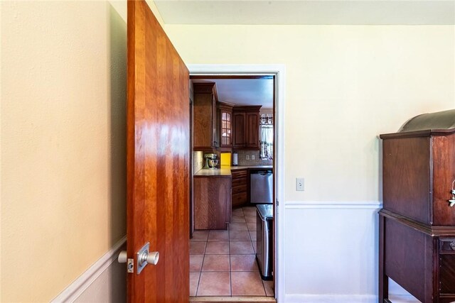 177 Pinewood St, Folkston, GA 31537 - kitchen featuring stainless steel dishwasher, light tile patterned flooring, and tasteful backsplash