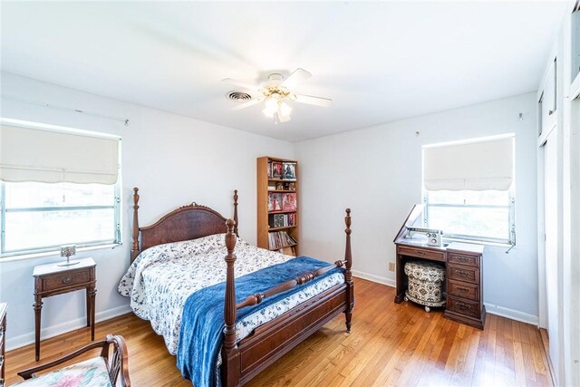 177 Pinewood St, Folkston, GA 31537 - bedroom featuring multiple windows, wood finished floors, and ceiling fan