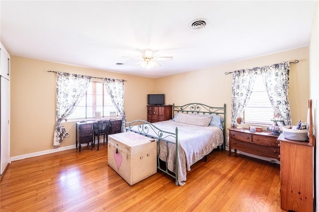 177 Pinewood St, Folkston, GA 31537 - bedroom with light wood finished floors and a ceiling fan