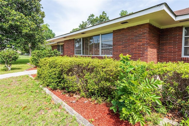177 Pinewood St, Folkston, GA 31537 - view of side of property featuring brick siding and a lawn