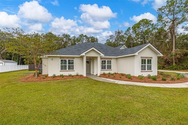 ranch-style house featuring a front lawn