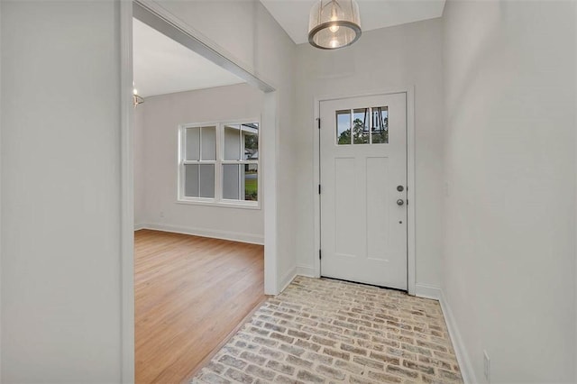 foyer entrance with light wood-type flooring