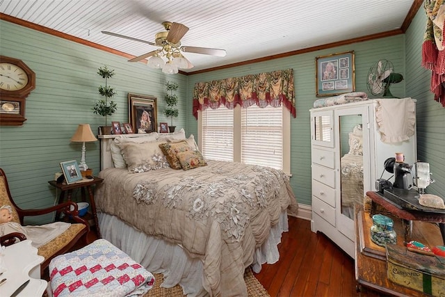 bedroom featuring ornamental molding, ceiling fan, and dark wood-type flooring