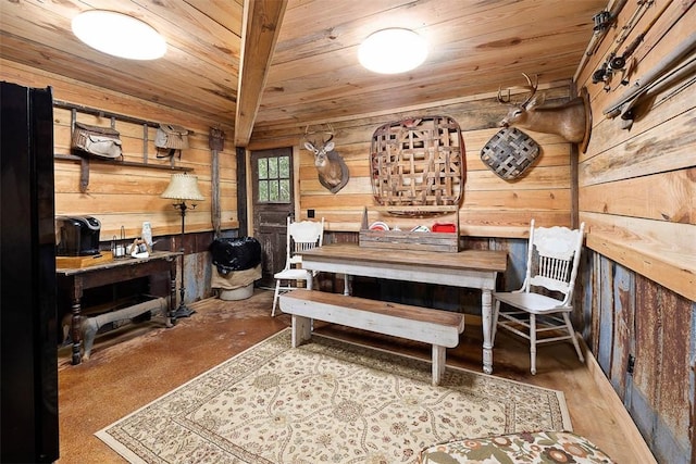 dining area with wooden ceiling and wood walls