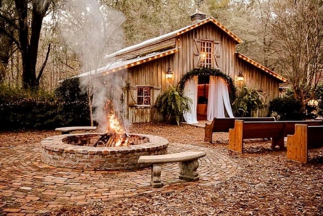 exterior space with an outdoor fire pit