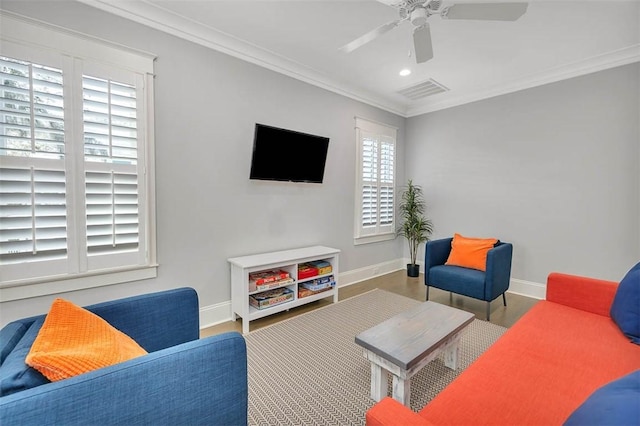 living room featuring wood-type flooring, ceiling fan, and crown molding