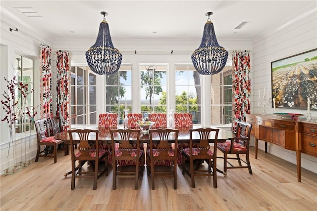49 Hatton Ln, Saint Simons Island, GA 31522 - sunroom / solarium featuring a chandelier and plenty of natural light